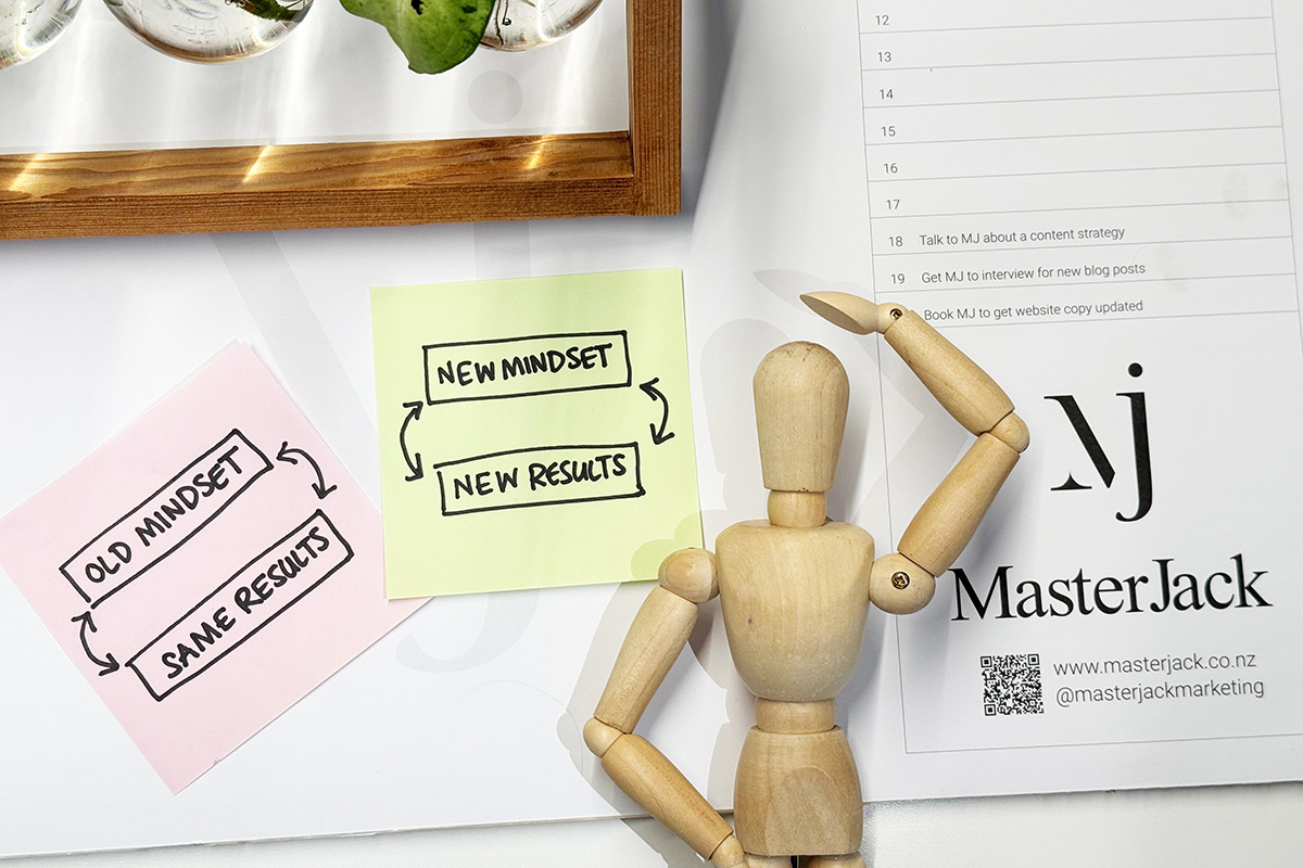 MasterJack mascot posing with diagram about mindset